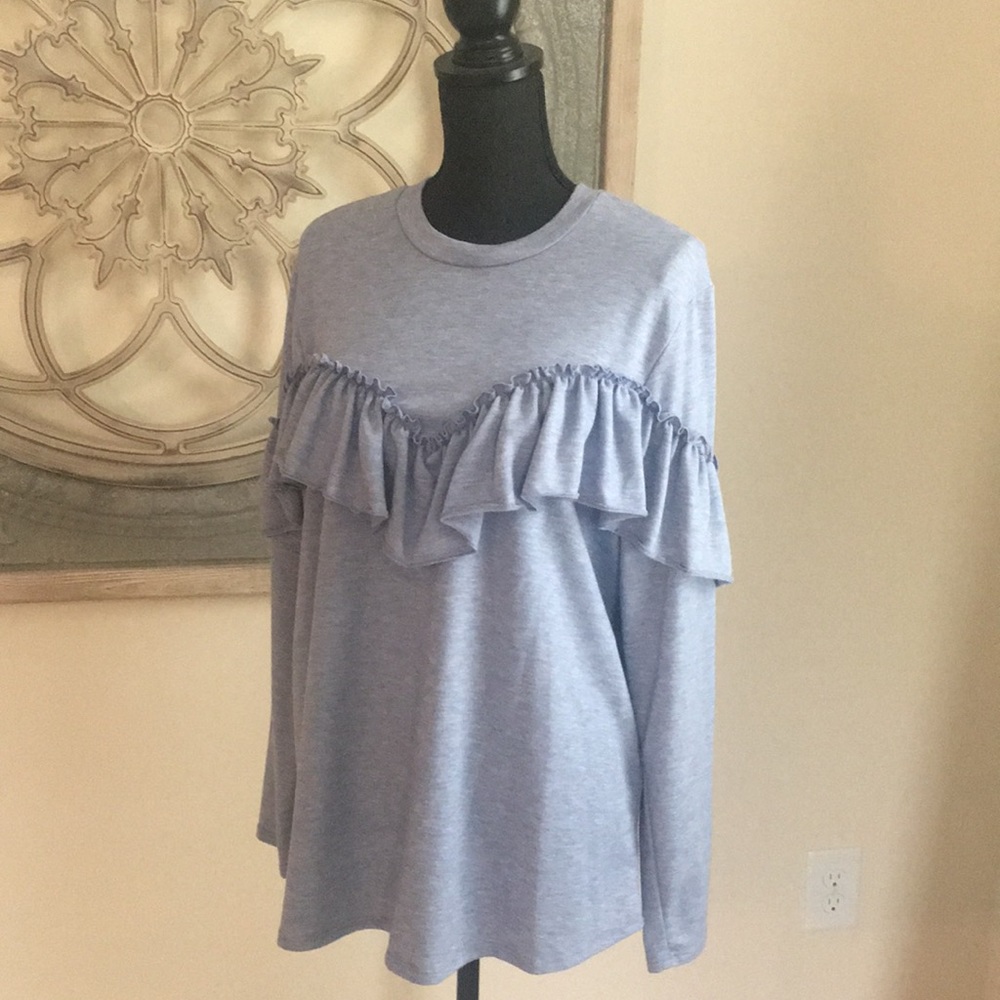 Cozy fleece with ruffle accent!